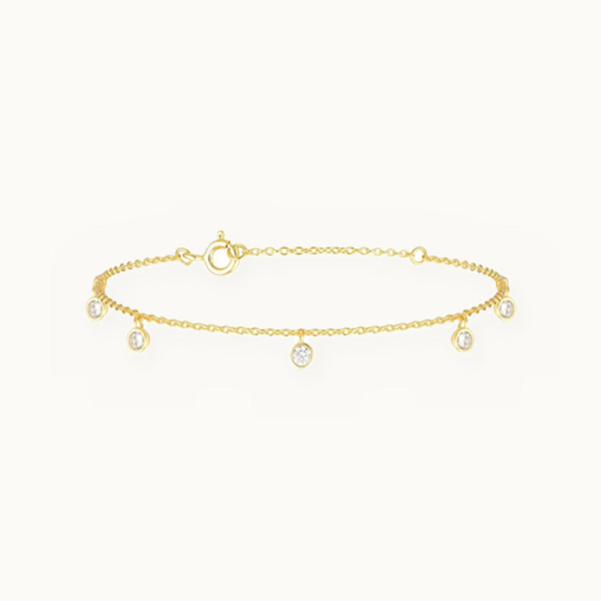 Fine gold bracelet with hanging bezel-set stone drops
