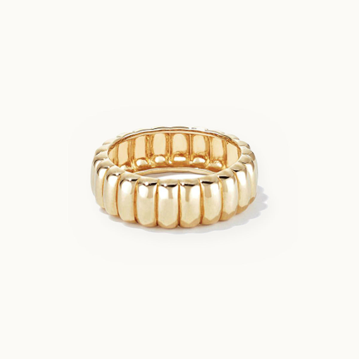 Wide gold band ring with deep fluted grooves