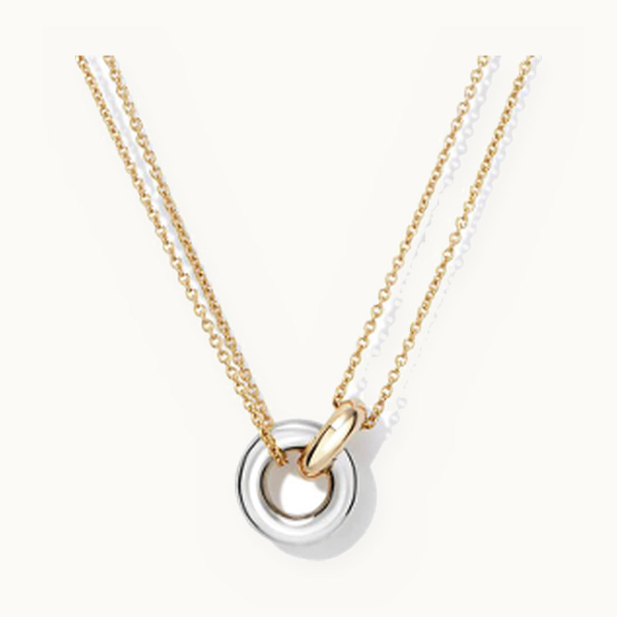 Layered necklace with interlocking silver and gold circles