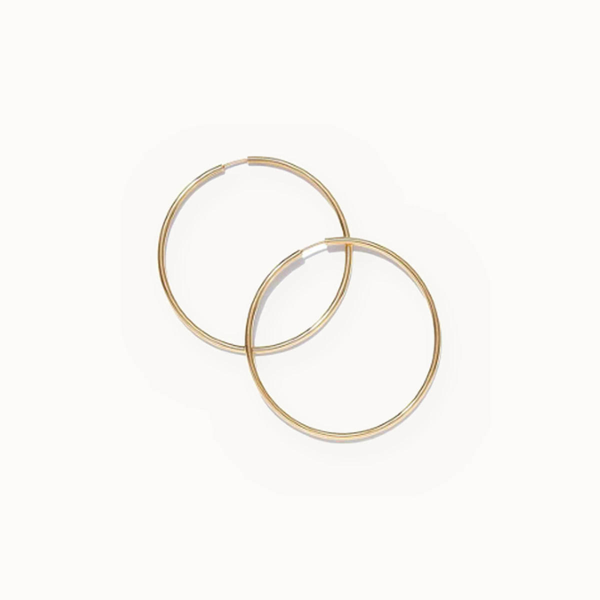 Pair of large thin endless gold hoop earrings