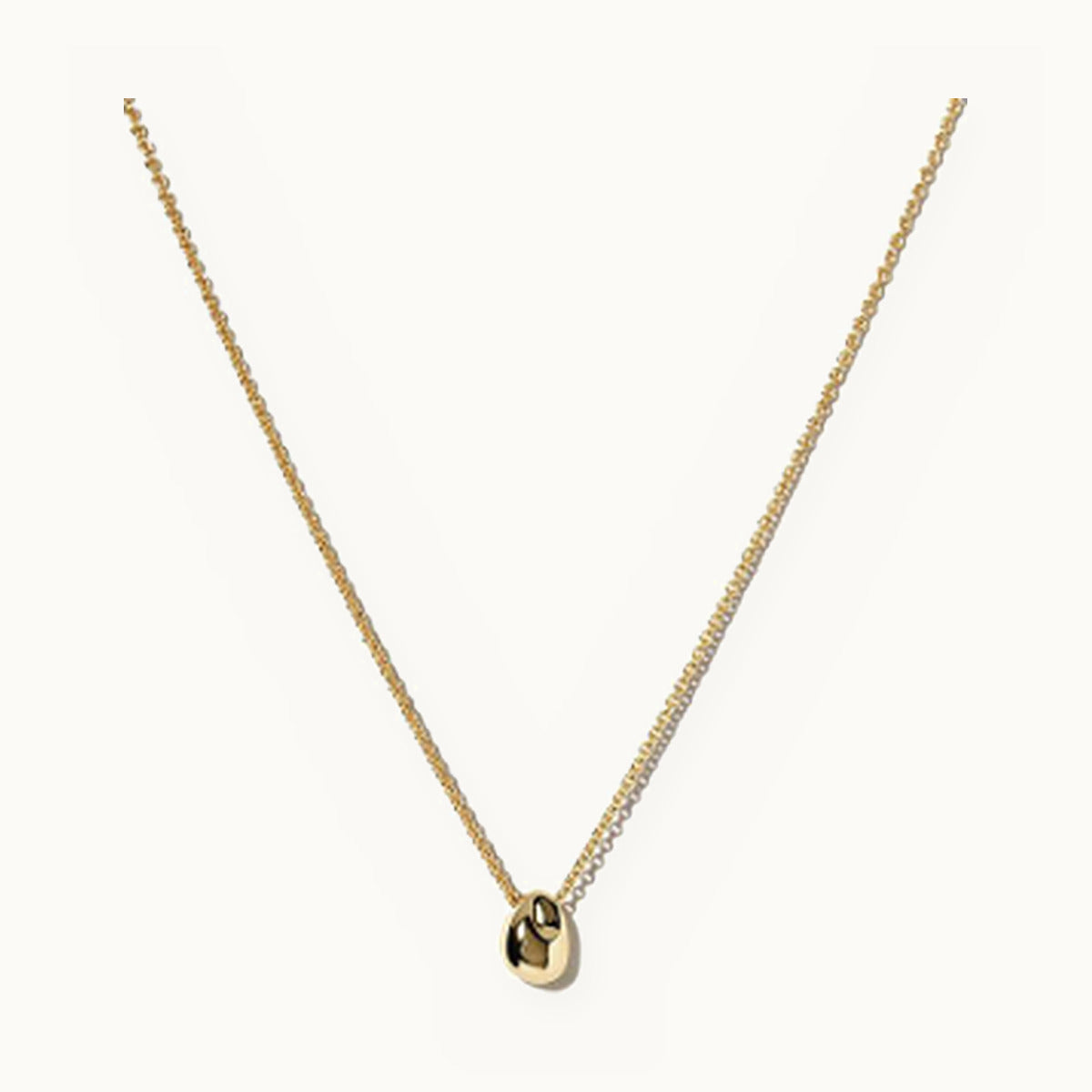 Fine gold necklace with a smooth pebble pendant