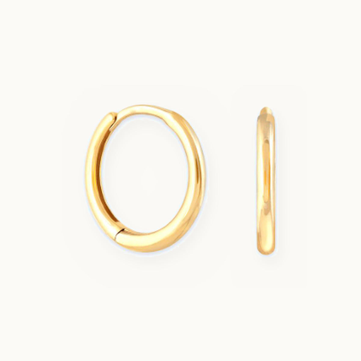 Pair of small oval gold huggie earrings
