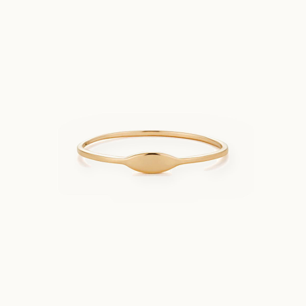 Thin gold ring with a slim polished oval bar