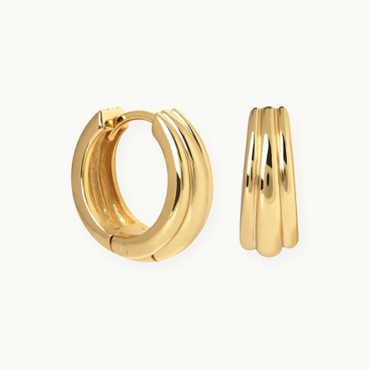 Pair of gold huggie earrings with three smooth ridges