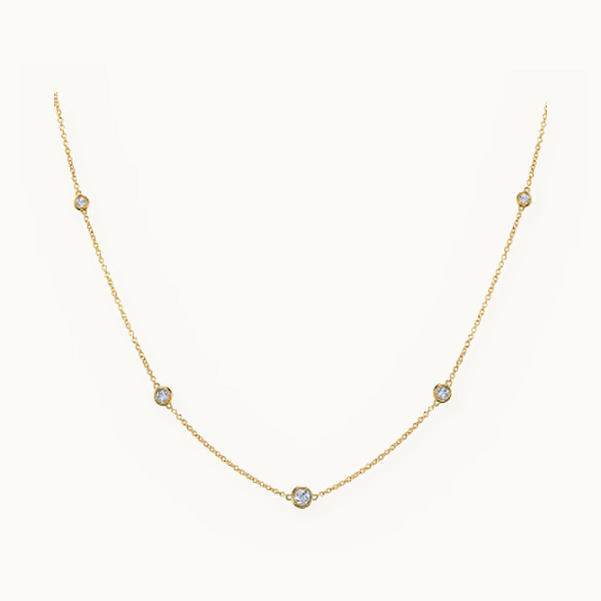 Gold chain necklace with evenly spaced bezel-set stones