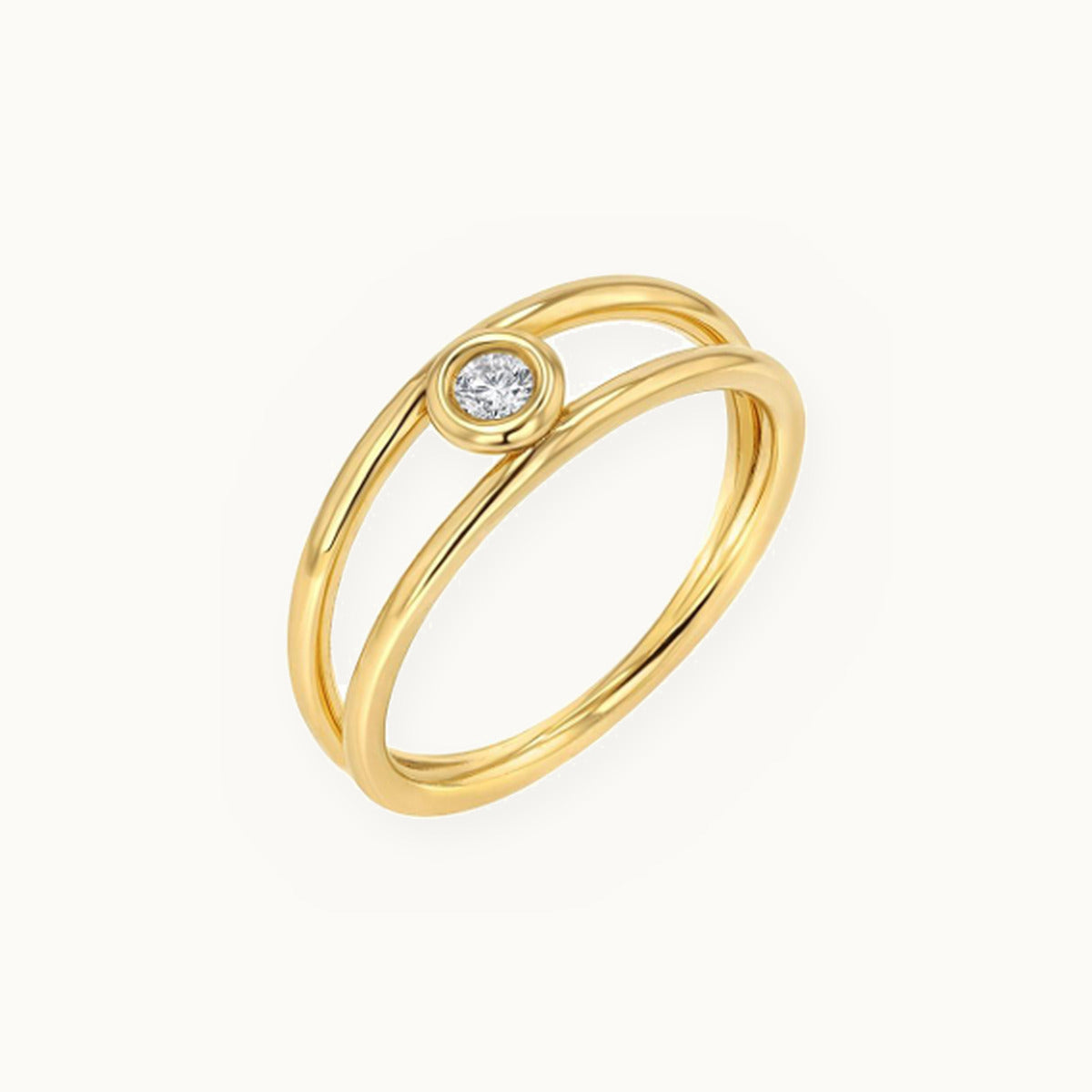 Gold double band ring with a bezel-set centre stone