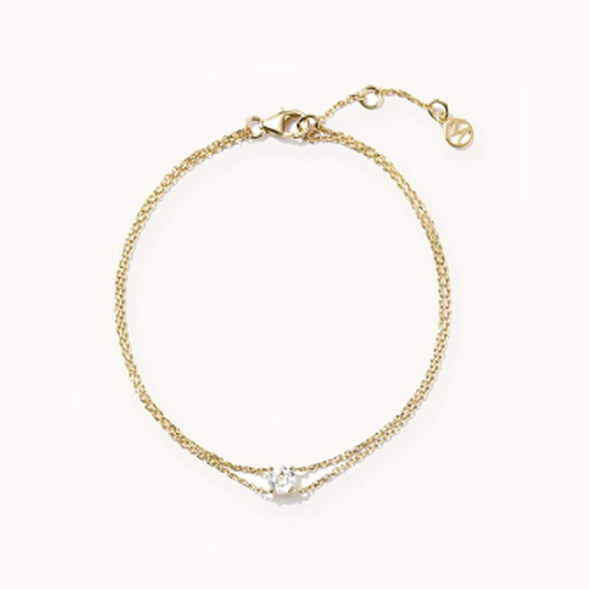 Double strand gold bracelet with a single solitaire stone