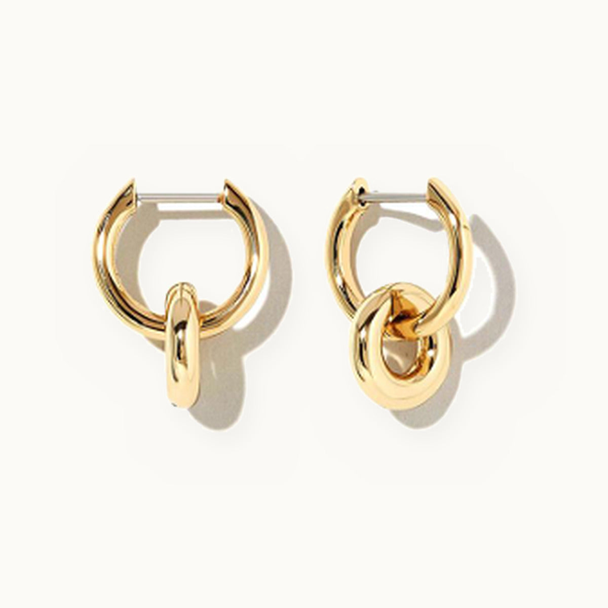 Gold huggie earrings with a smooth linked charm drop