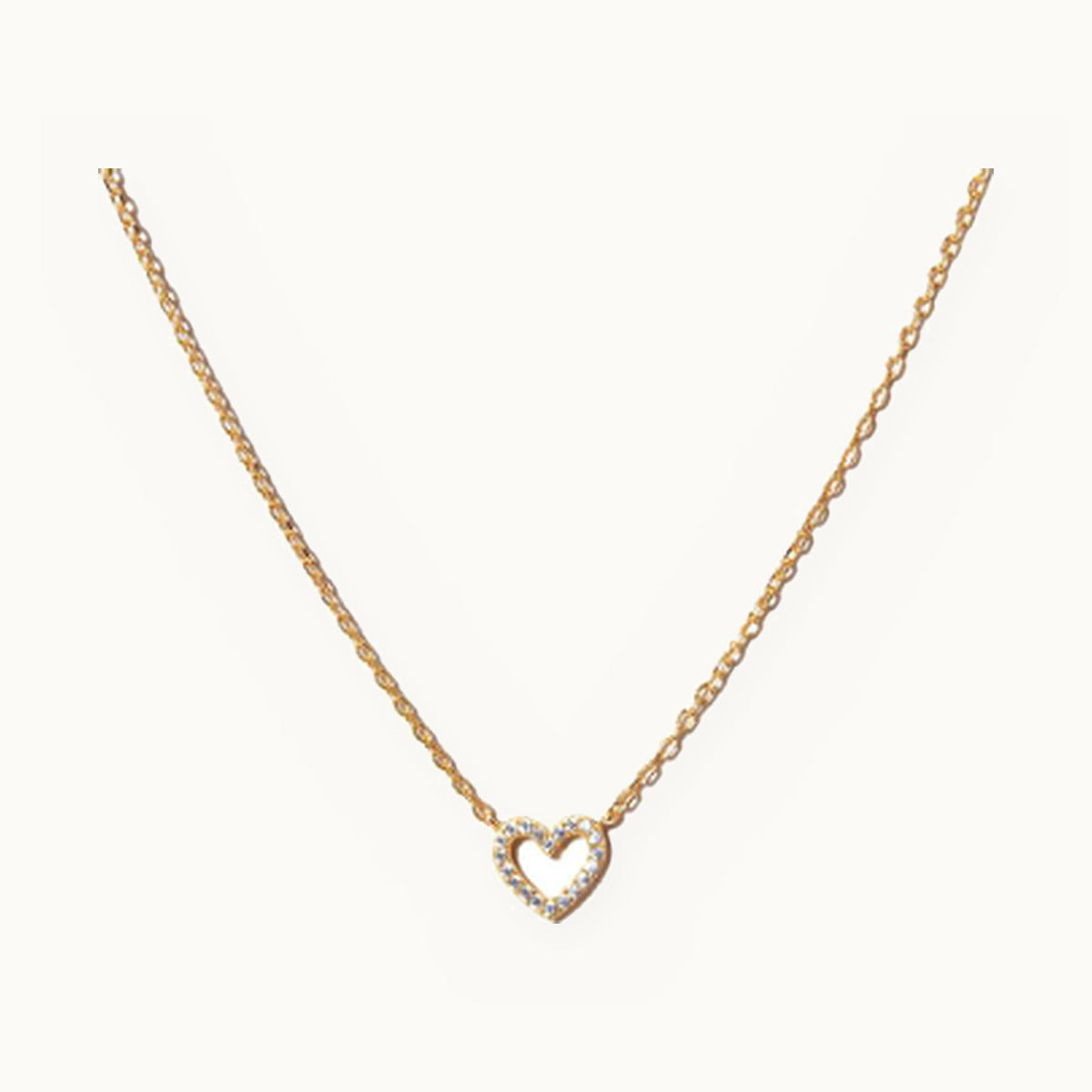 Fine gold necklace with a small open pavé heart