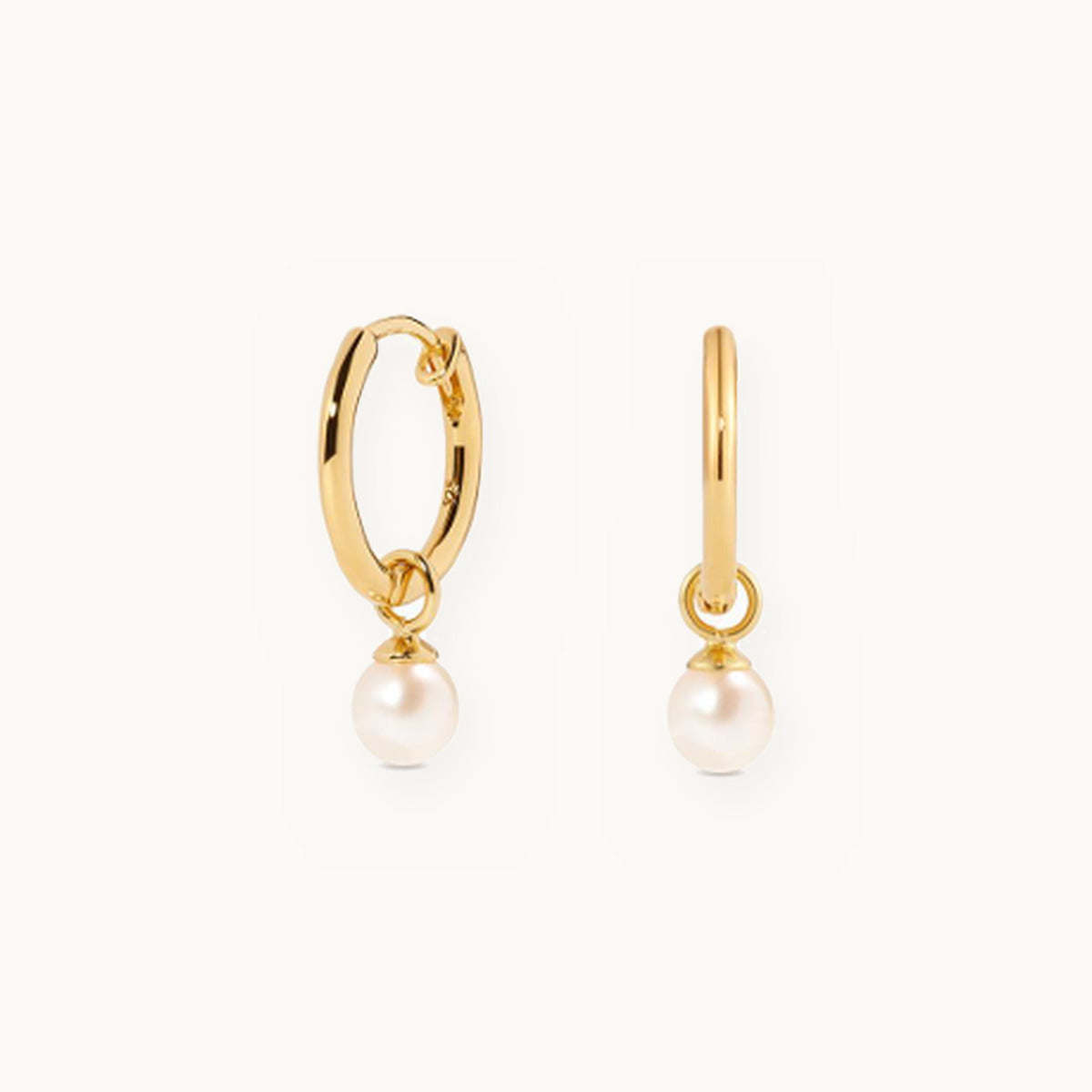Gold huggie earrings with hanging pearl drops