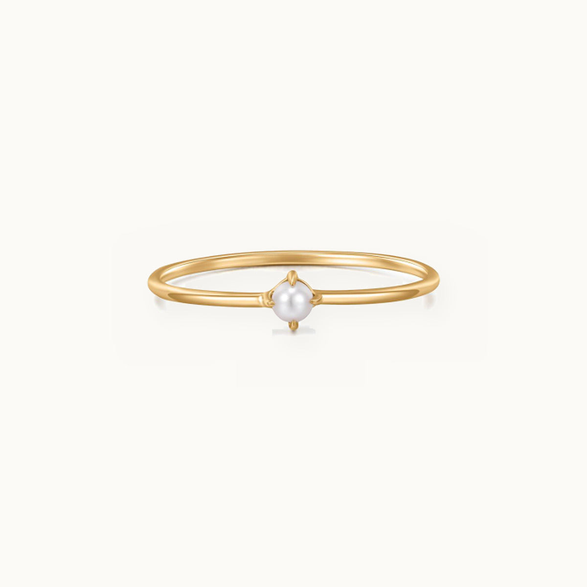Fine gold ring with a single small pearl