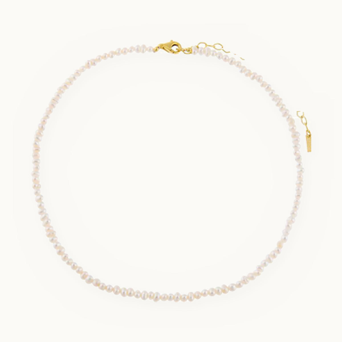 Small white pearl choker necklace with gold clasp