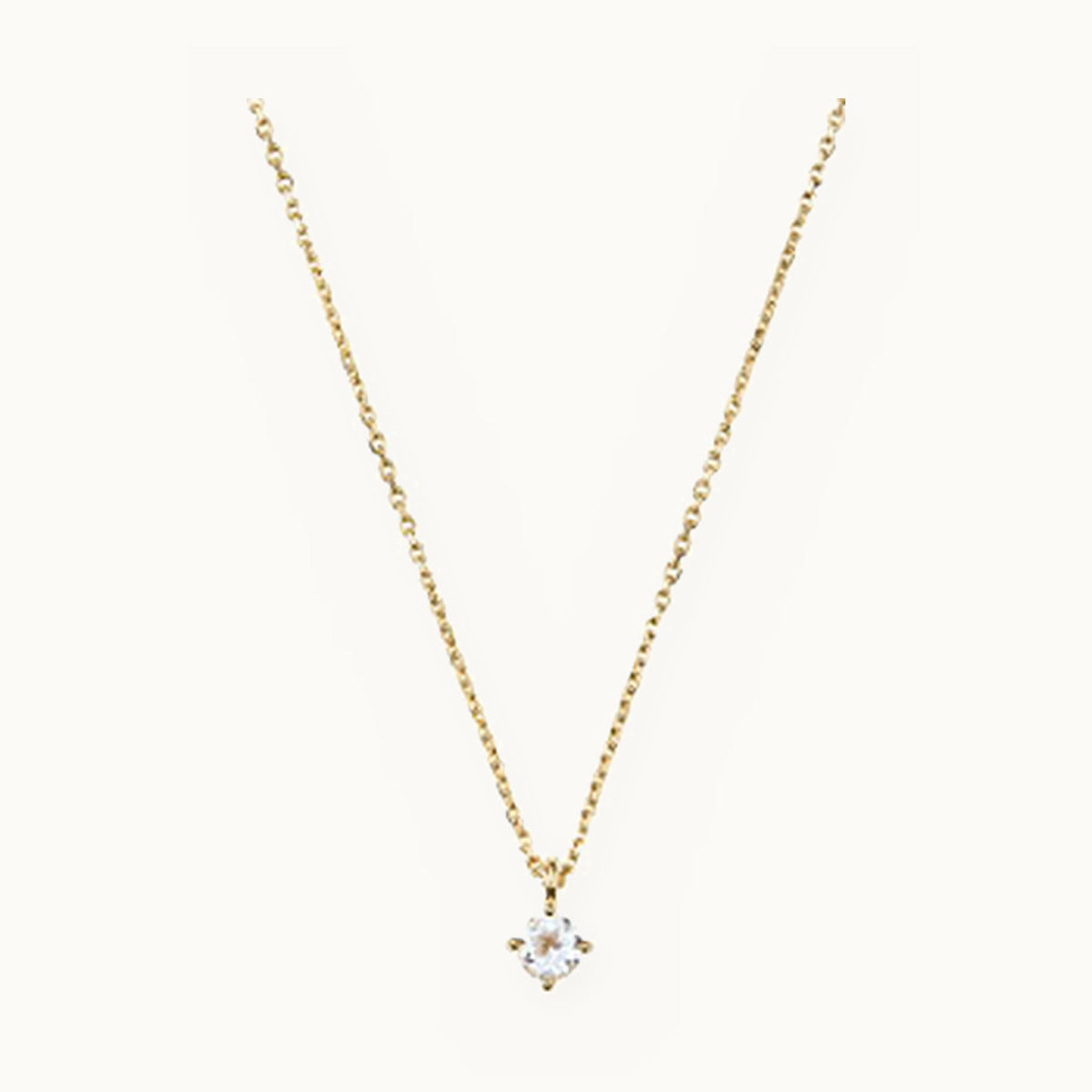 Fine gold necklace with a prong-set solitaire stone