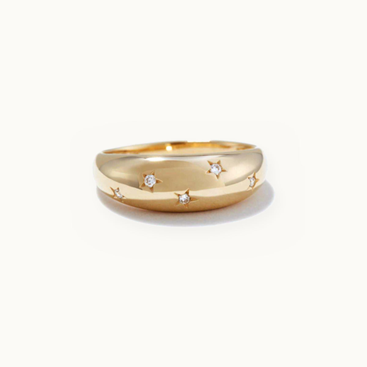 Gold dome ring with scattered star-set stones